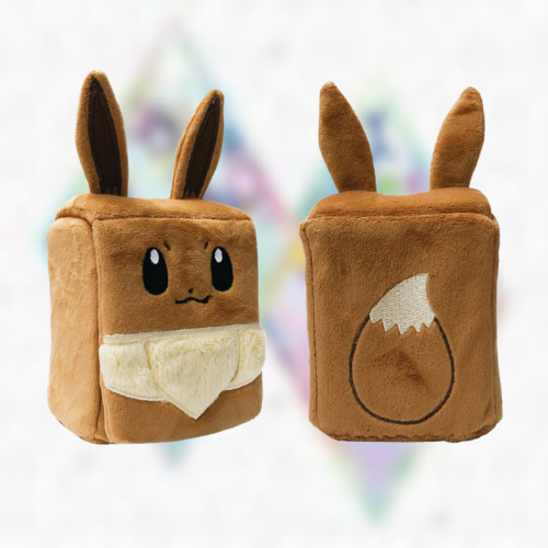 Two brown plush deck boxes with ears and embroidered tail in the style of Eevee on a colourful blurred background