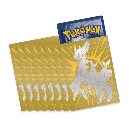 Pokémon trading card packs with a prominent card featuring a silver Arceus  illustration on a gold background.